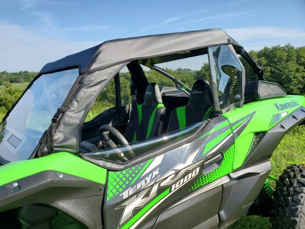 3 Star cab enclosure on a Kawasaki KRX with the passenger door open showing the seats and roll cage
