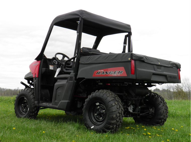 Side view of a red Polaris Ranger 570 midsize with the 3 Star vinyl windshield and top combo installed