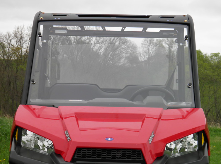 Front view of the 3 Star one-piece windshield on a red Polaris Ranger 570 MidSize showing the full clear panel