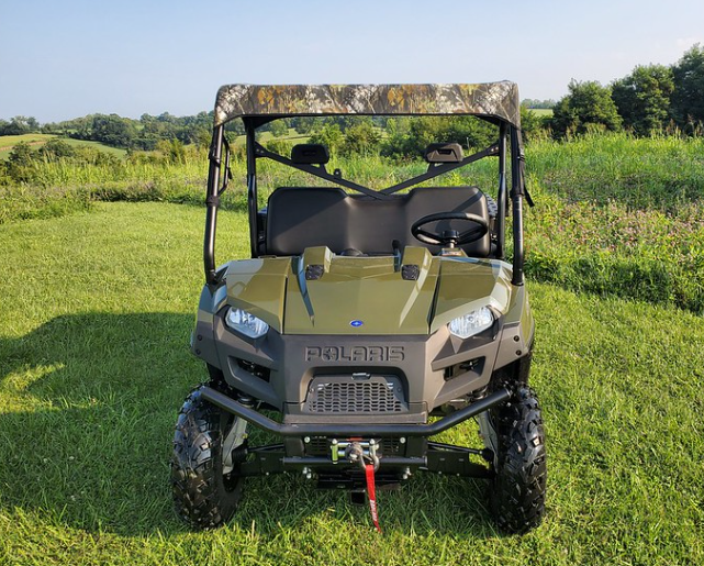 Front view of a green Polaris Ranger 570-3 wearing the camo 3 Star soft top above the open cab