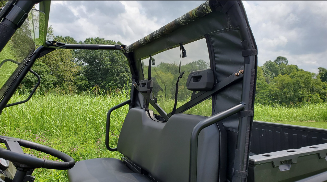 Inside view from the Polaris Ranger 570-3 cab of the camo 3 Star rear window behind the bench seat