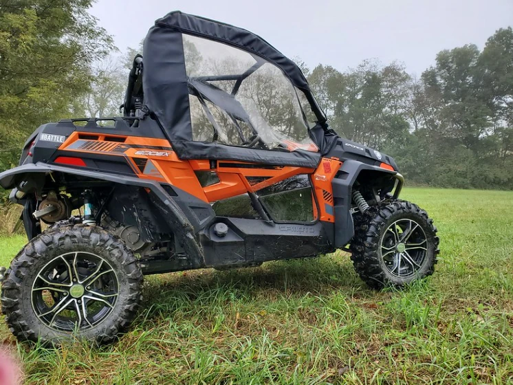 Driver side view of the 3 Star soft doors on an orange CFMoto ZForce, showing the door window and zipper