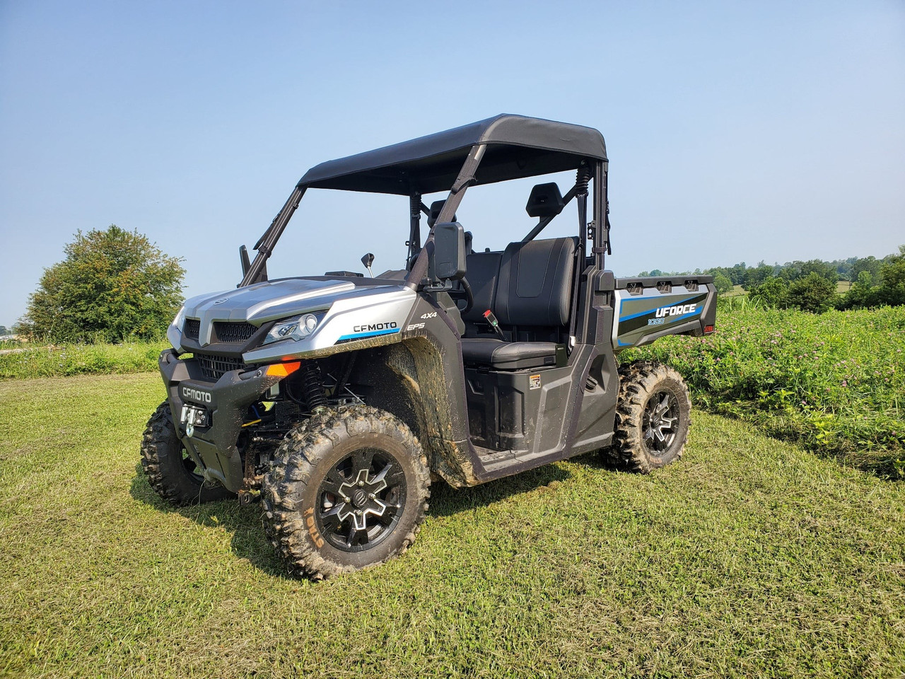 3 Star black soft top on a silver CF Moto UForce 1000, front 3/4 view on grass