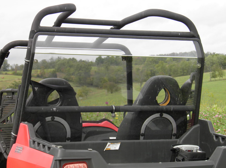 3 Star Lexan rear window installed behind the seats of a red Hisun 800, rear view through the cage
