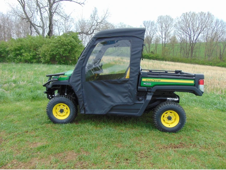 Side profile of the green John Deere Gator XUV 835/865 with the 3 Star soft door closed