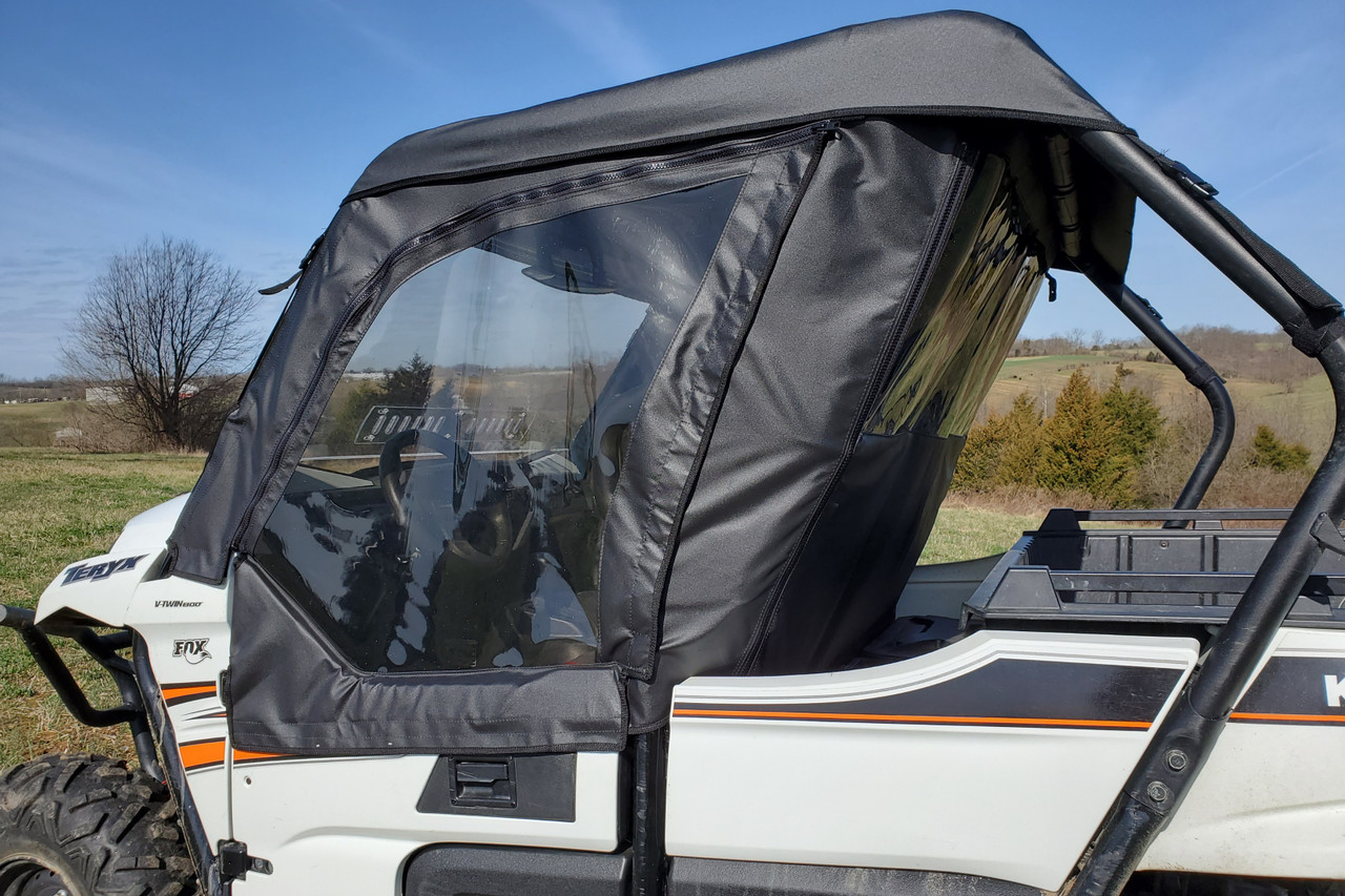 Close side view of a white Kawasaki Teryx with the 3 Star black soft top and matching soft doors installed