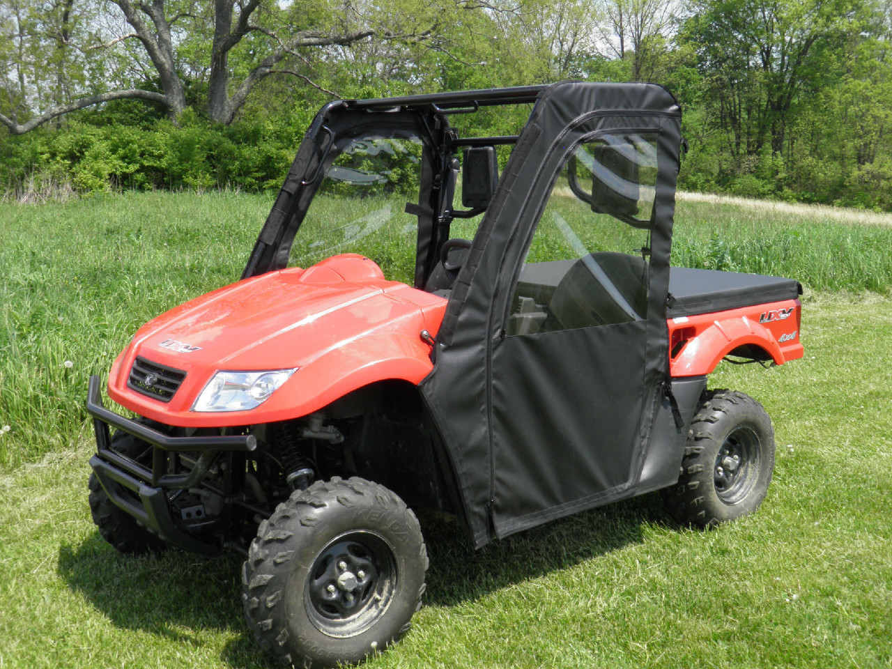 Front three-quarter view of a red Kymco 700 with the 3 Star soft doors zipped closed and rear window in place