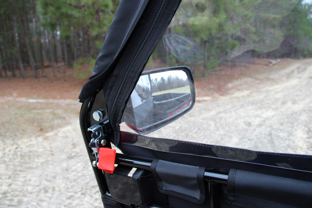 Close-up of the Seizmik hard framed door hinge, red latch pin and side mirror on a Polaris Ranger XP700/800, inside view