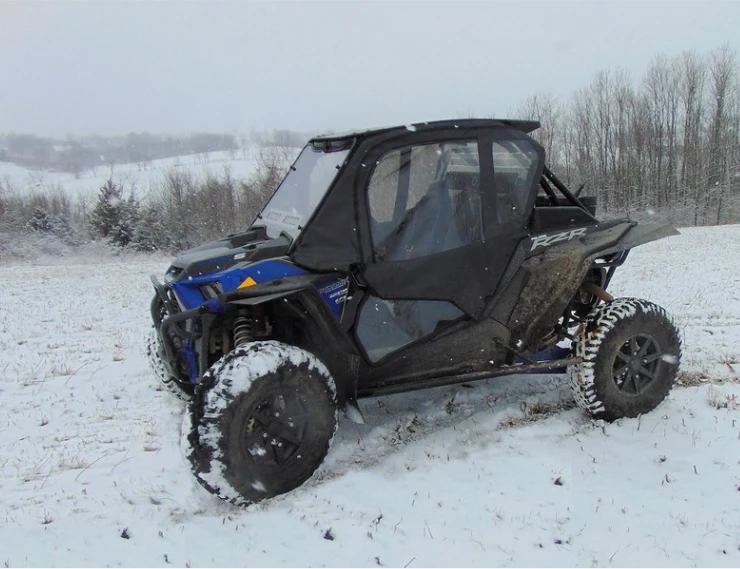 Blue Polaris RZR XP Turbo S with the 3 Star soft upper doors installed, front three-quarter view in snow