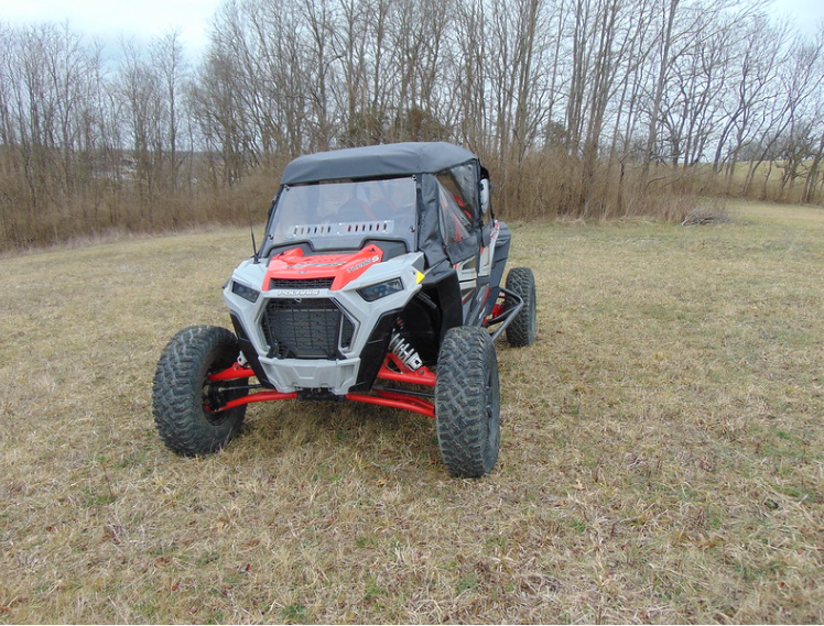 Front view of a Polaris RZR XP 4 Turbo S with the 3 Star soft doors and a soft top fitted