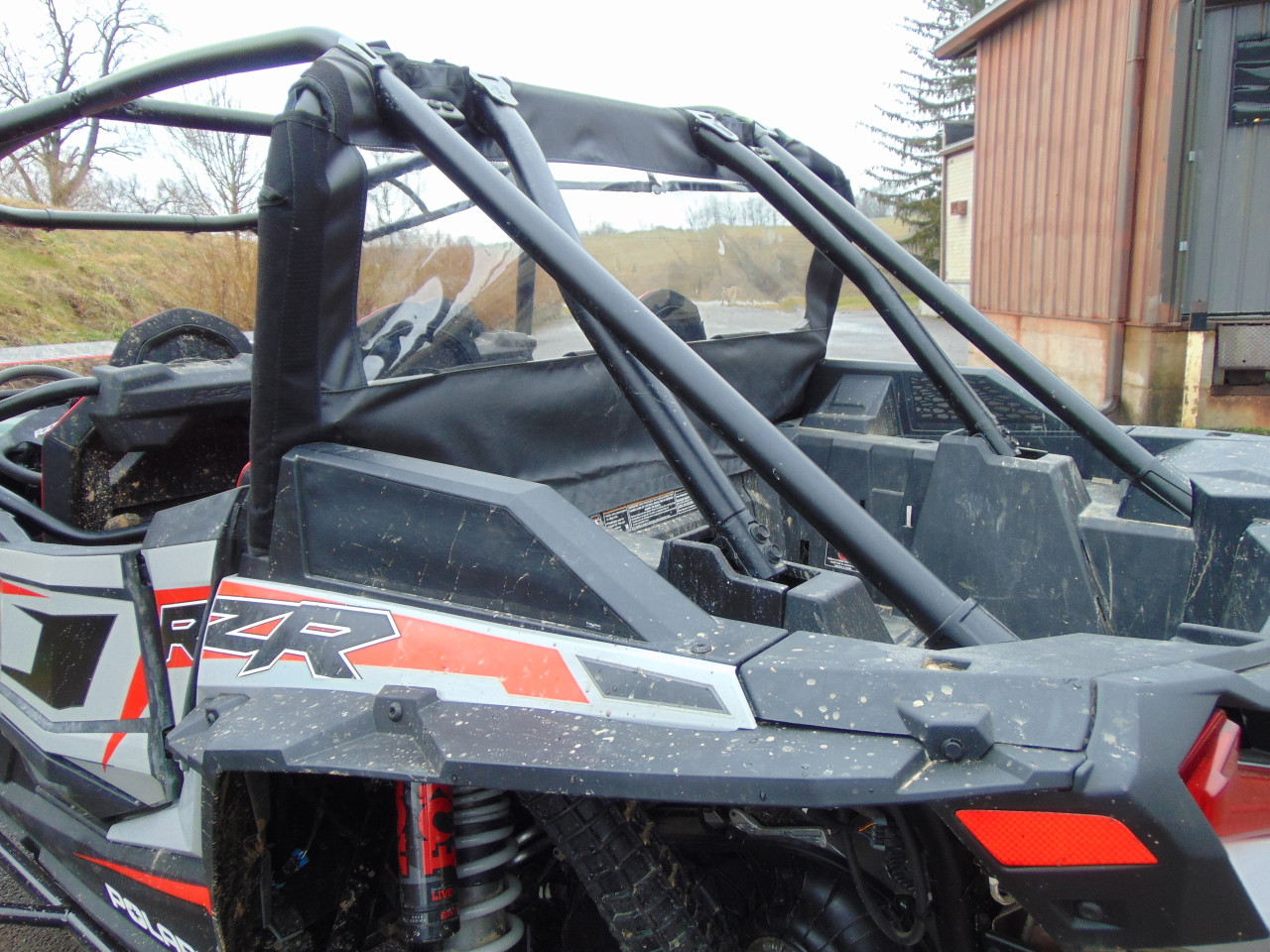 Rear three-quarter view of a RZR XP 4 Turbo S with the 3 Star soft back panel installed, roll cage and bed in frame
