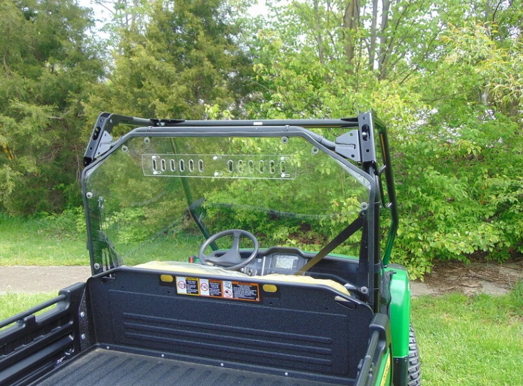 Rear view from behind the tailgate of the 3 Star Lexan back panel with vent slots on the John Deere Gator XUV