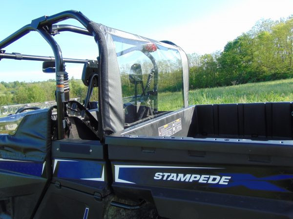 3 Star soft rear window with clear panel behind the cab of an Arctic Cat Stampede, seen from the bed side