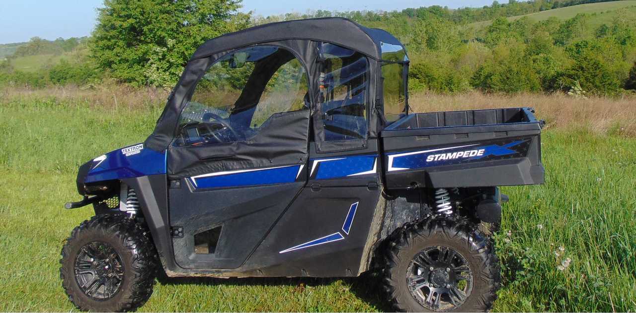 Side view of a blue Arctic Cat Stampede with the 3 Star full cab enclosure soft doors and top installed