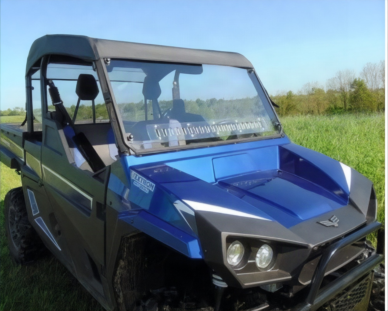 3 Star soft top installed on a blue Arctic Cat Stampede with a hard windshield, front three-quarter view