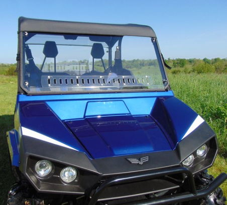 High front view of the 3 Star one-piece scratch-resistant windshield with vents on a blue Arctic Cat Stampede