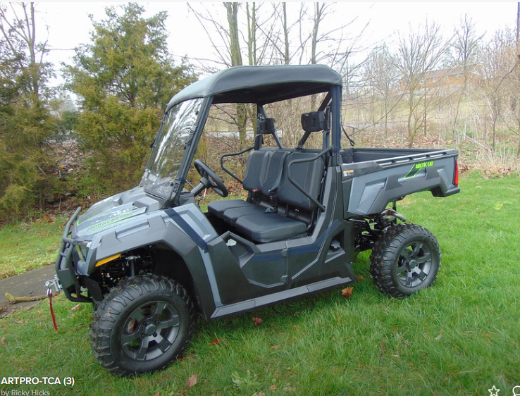 Front three-quarter view of a gray Arctic Cat Prowler Pro with the 3 Star black soft top installed
