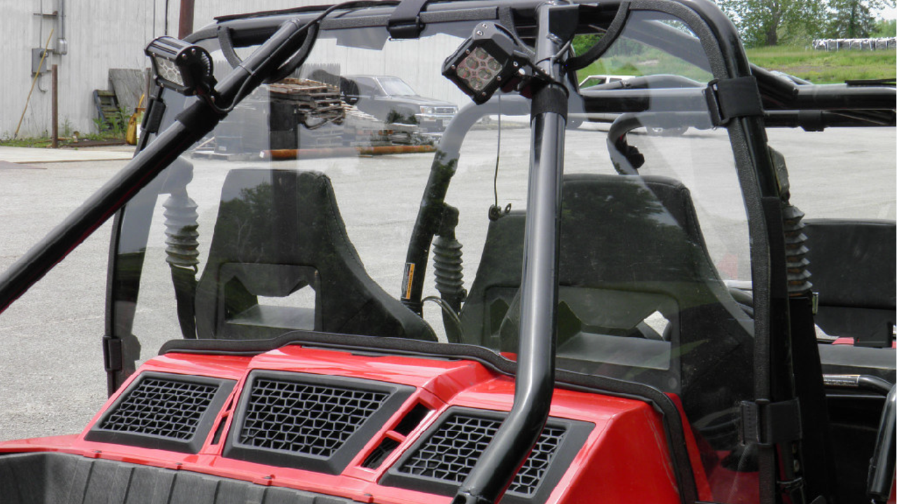 Rear view of the 3 Star Lexan back panel on a red Arctic Cat Wildcat 4 showing the engine vent grilles