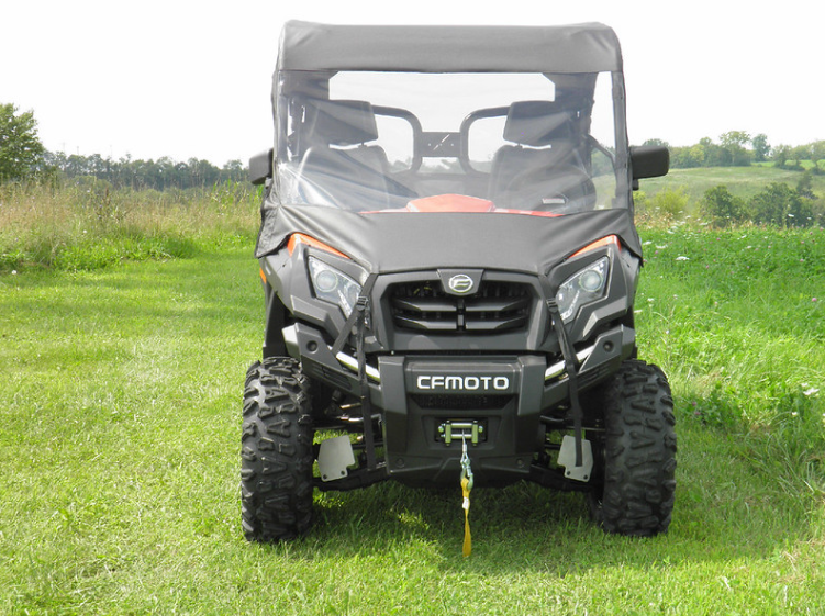 Straight front view of a CF Moto 500/800 with the 3 Star vinyl windshield and top installed, parked on mowed grass
