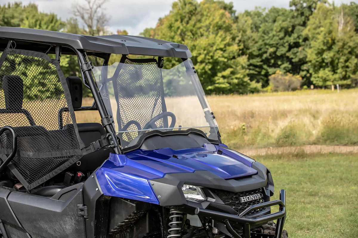 Kolpin poly roof installed on a blue Honda Pioneer 700 with windshield, front close-up