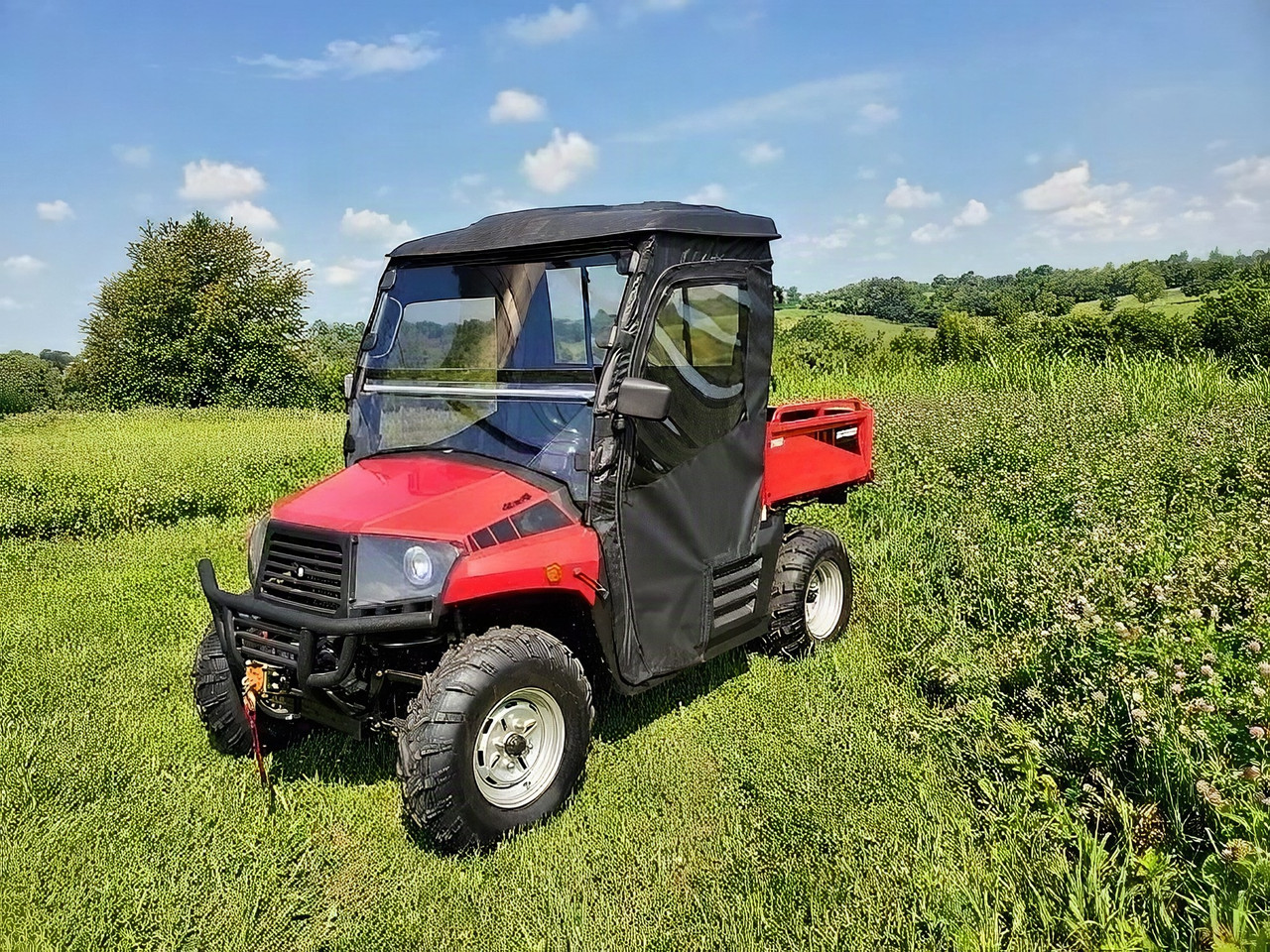 3 Star soft doors and rear window combo installed on a red Coleman/Hisun 400 in a field, front three-quarter view