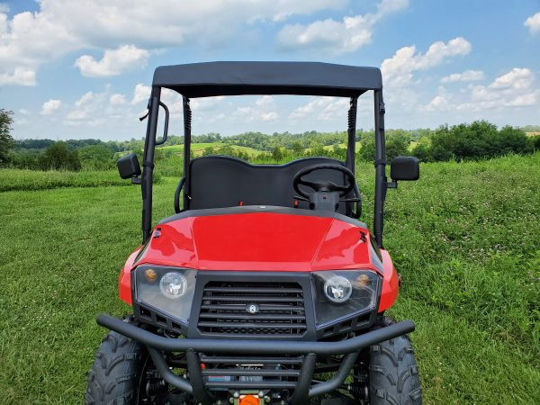 Straight front view of the red Coleman UT400 with the 3 Star soft top over the roll cage and hood