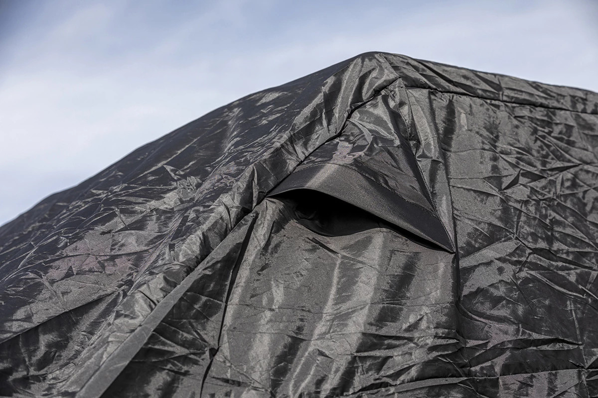 Close-up of the Kolpin UTV cover fabric showing the vent flap and water-resistant material