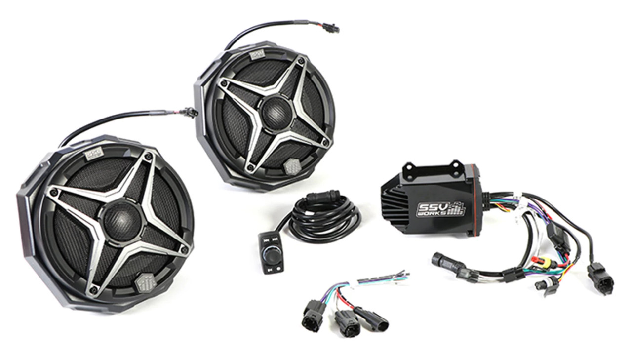 Pro Armor 2-speaker cage audio kit laid out, two 6.5-inch cage speakers, amplifier, Bluetooth controller and wiring