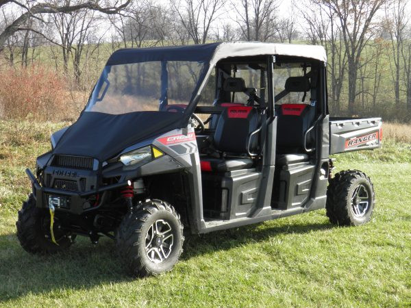 3 Star vinyl windshield and soft top combo on a Polaris Ranger 1000 Crew, front three-quarter view in a field