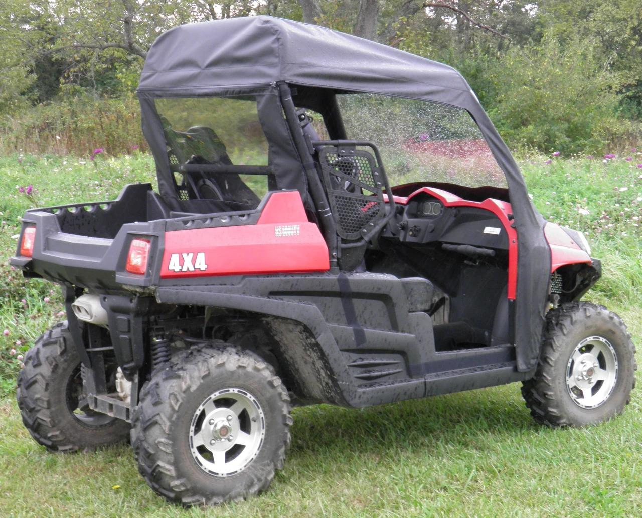 Rear three-quarter view of the 3 Star soft top and rear window on a red Hisun 500/700 with 4x4 badge
