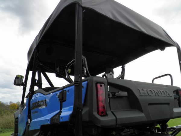 Rear three-quarter view of the 3 Star soft top stretched over the cage of a blue Honda Pioneer 1000-5