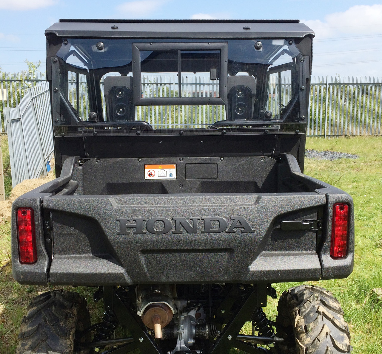 Honda Pioneer 700 hard cab enclosure by HardCabs - steel roof, tilt-out glass windshield, poly doors