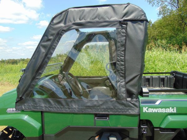 Close side view of the 3 Star soft door with clear window zipped shut on the green Kawasaki Mule Pro-MX