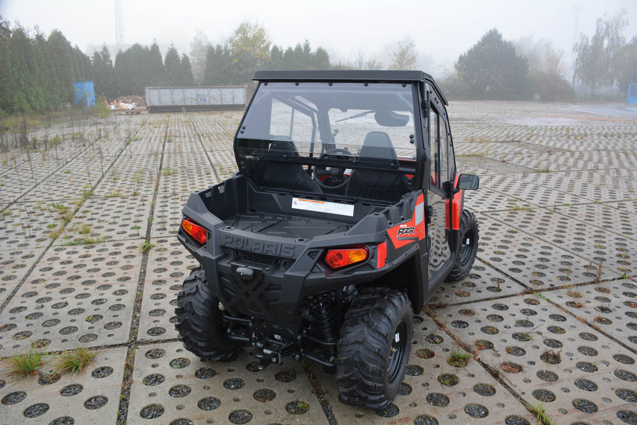 Polaris RZR 570 hard cab enclosure by HardCabs - steel roof, tilt-out glass windshield, poly doors