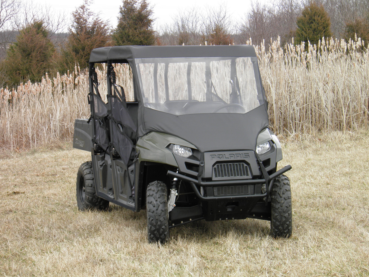 3 Star vinyl windshield and top enclosure on a gray Polaris Ranger 570-4 in a field, front three-quarter view