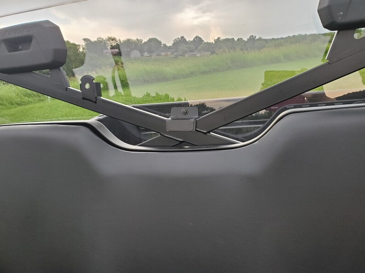 Close-up of the 3 Star Lexan back panel clamp mounts on the cage behind the Polaris Ranger Crew headrests