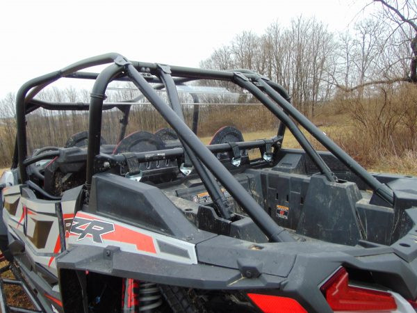 Rear three-quarter close view of the 3 Star Lexan back panel in the cage of a gray and red Polaris RZR XP 4