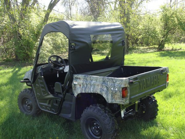 Rear three-quarter view of the 3 Star rear window panel and top on a camo Yamaha Rhino with cargo bed