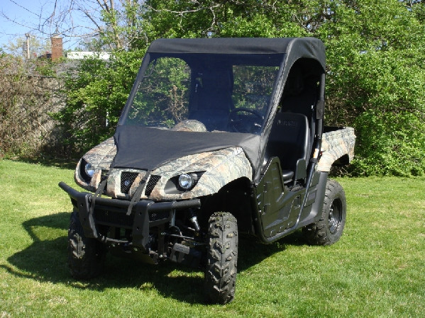3 Star vinyl windshield, top and rear window combo installed on a camo Yamaha Rhino, front three-quarter view