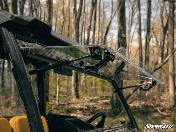 SuperATV flip windshield propped fully open on the John Deere Gator XUV835, side view from inside