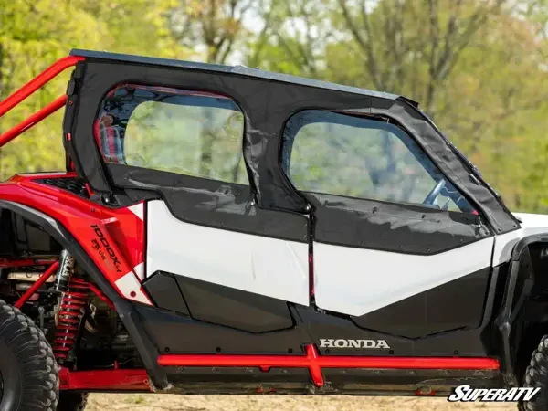 Full side view of both SuperATV soft upper doors on the Honda Talon 1000X-4 with the Honda rocker logo below