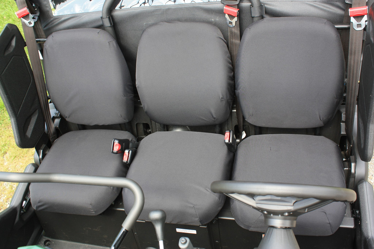 Greene Mountain black seat covers on the front bench of a Yamaha Viking VI with the steering wheel in view