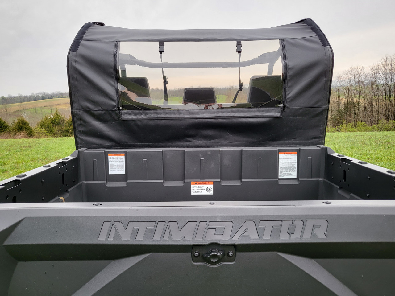 Rear view of the 3 Star soft back panel and clear window above the Intimidator GC1K cargo bed