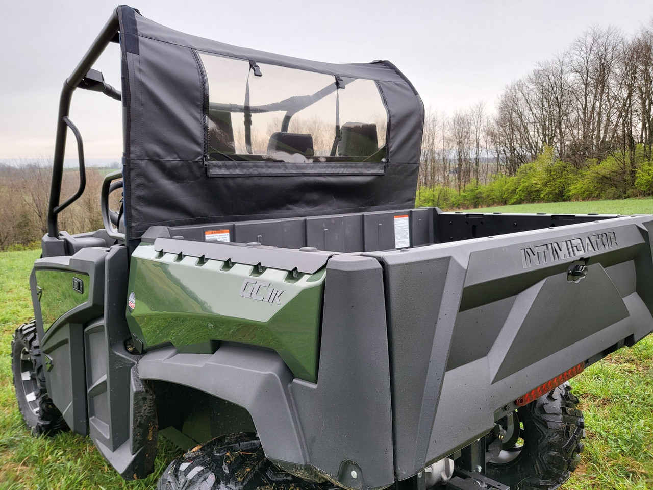 3 Star black soft back panel with clear window on a green Intimidator GC1K, rear 3/4 view outdoors