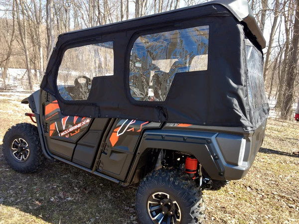 Side X Side cab enclosure doors and rear window on a Yamaha Wolverine X4, driver side rear angle in a winter yard