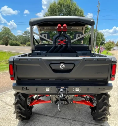 Straight rear view of a Can-Am Defender with the No Limit rear winch bumper and hook, outdoors