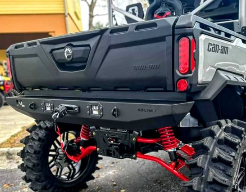 No Limit rear winch bumper with winch installed on a gray Can-Am Defender with red A-arms, rear three-quarter view