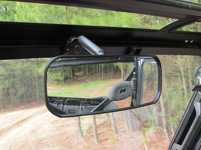 Seizmik wide angle rear view mirror mounted on a roof frame, viewed from inside a cab with a hard roof
