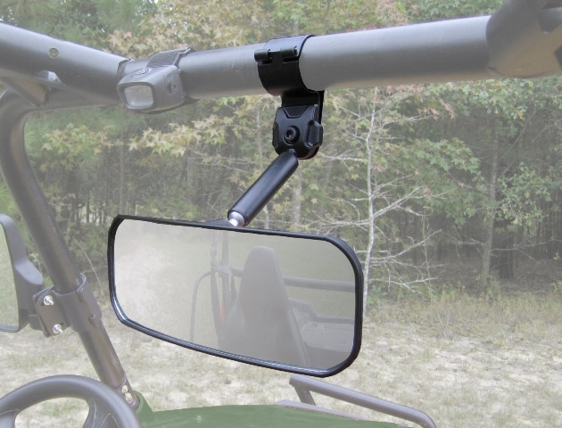 Seizmik wide angle rear view mirror clamped to the top roll cage bar, seen from inside a side-by-side cab