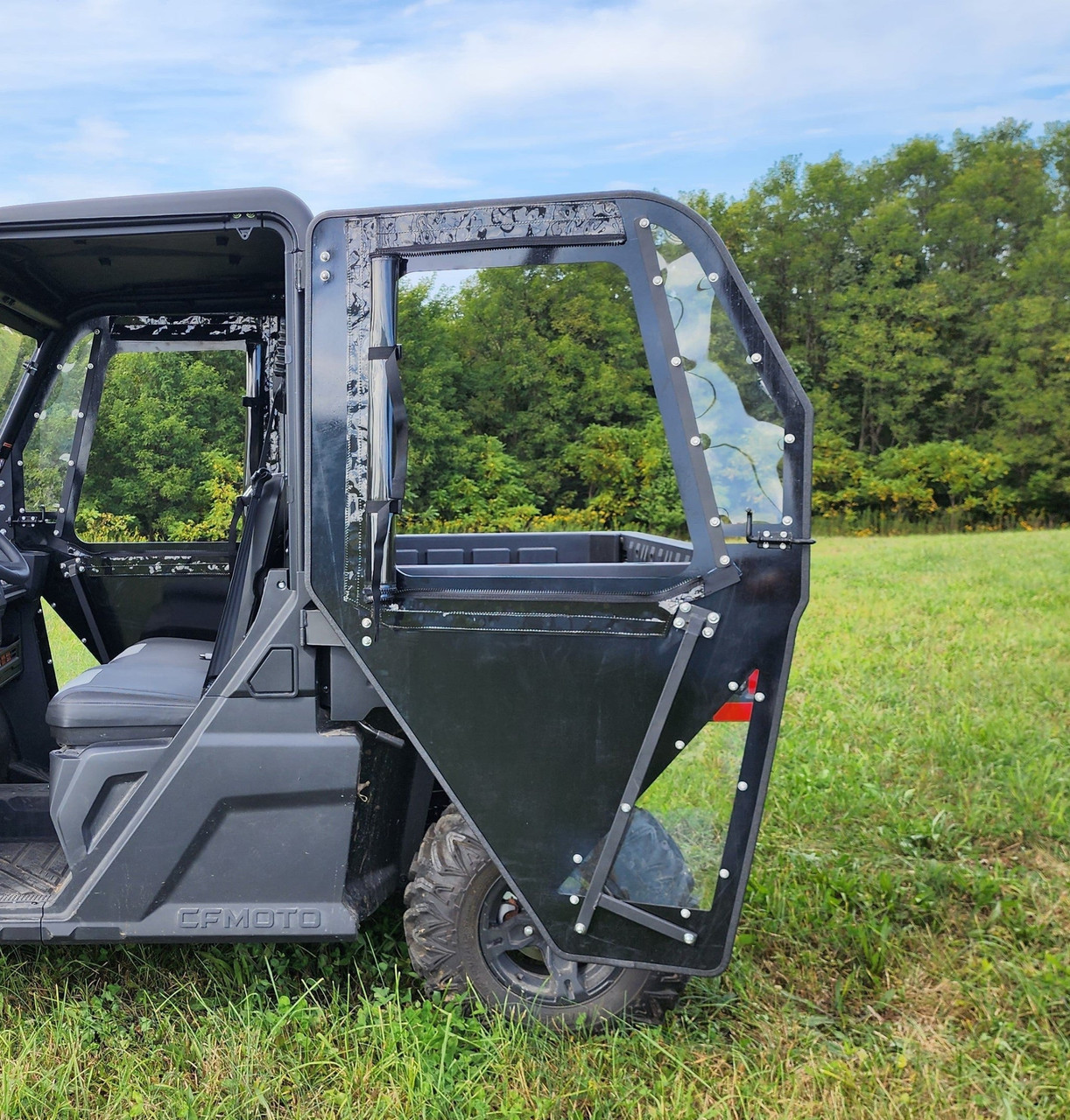 3 Star ABS hard door swung open on a CFMoto UForce 600 showing the black panel, window and edge hardware